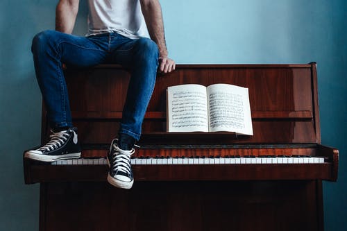 Man sitting on Piano