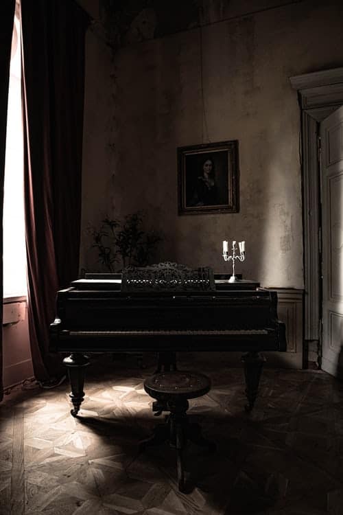 Grand Piano Near White Curtain